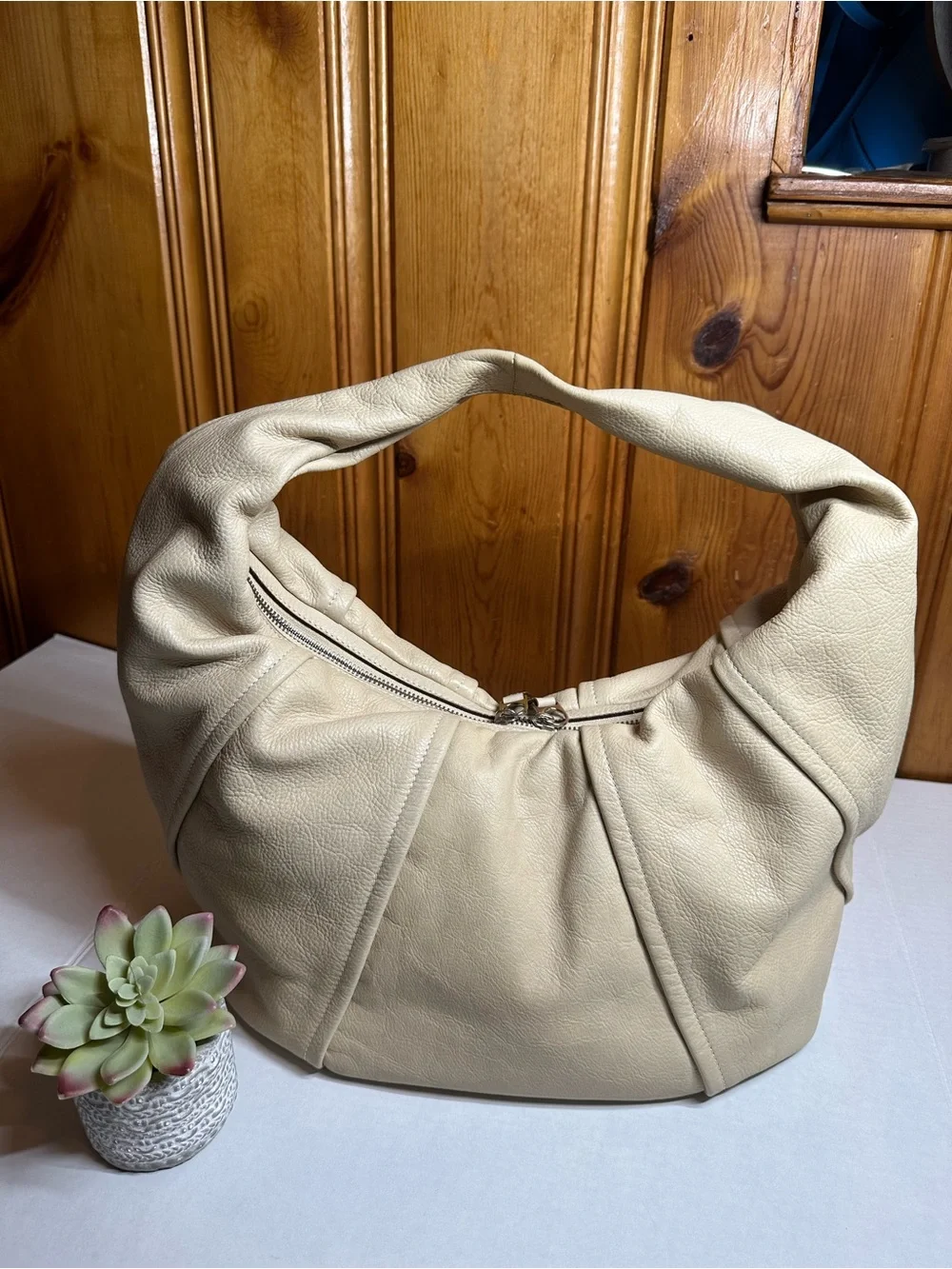 Cream Leather Shoulder Hobo Bag with Embossed Crest